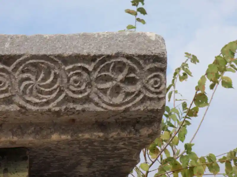 Swirls, solar cross, circles at the ancient church of Mary